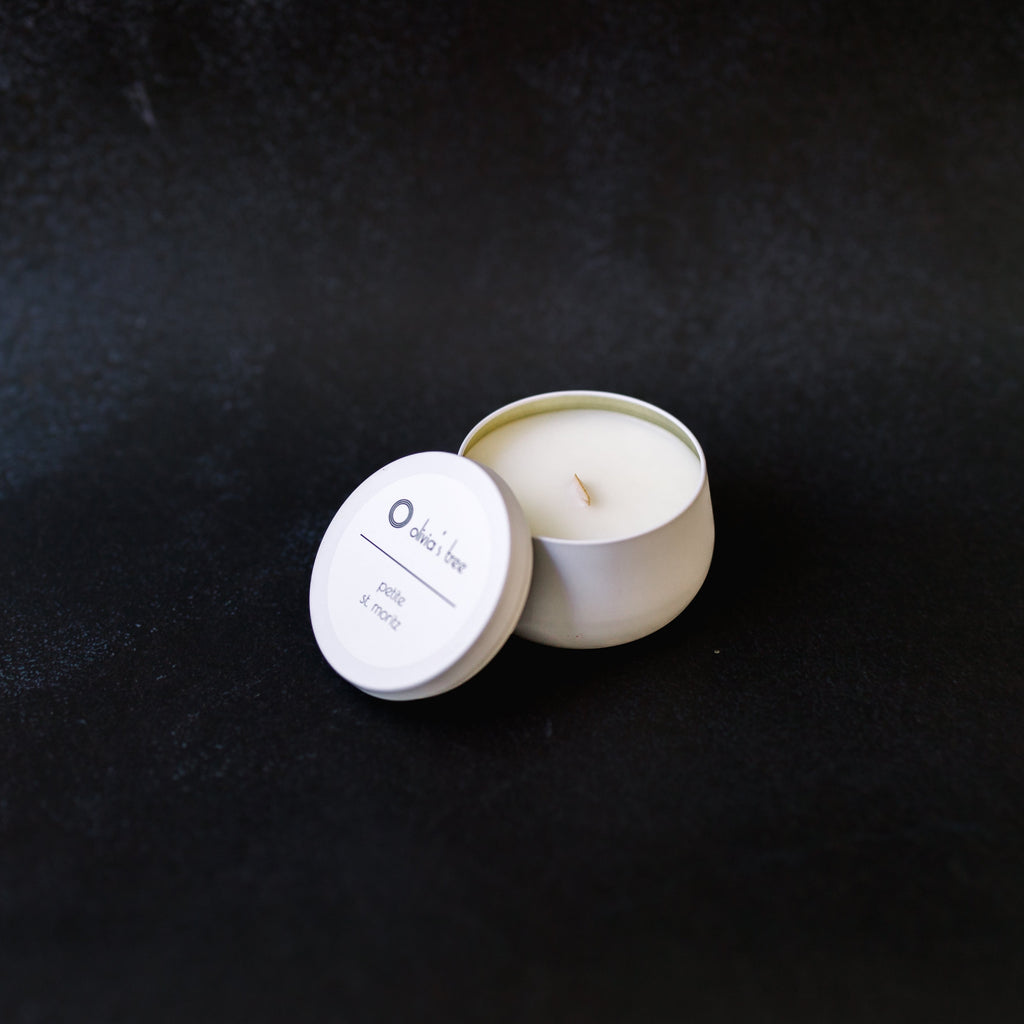 White round, bell shaped, metal container with a lid. It is 3.46"W x 2.2"H. The label is 2" round, white with black lettering, and placed on the lid.